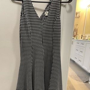 Size S black and white checkered dress, fitted in waist and flared at bottom
